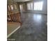 Spacious living room featuring large windows and ceramic tile flooring at 9622 Staff Ln, Las Vegas, NV 89178