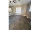 Well-lit living room featuring tile flooring and windows with shutters at 9622 Staff Ln, Las Vegas, NV 89178