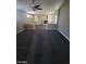 Spacious carpeted living room with a fireplace and bright windows offering lots of light at 9622 Staff Ln, Las Vegas, NV 89178