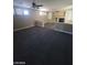 Carpeted living room with a fireplace and bright windows offering lots of light at 9622 Staff Ln, Las Vegas, NV 89178