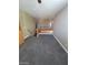 Upstairs loft area with carpeted floors and views of the home's staircase at 9622 Staff Ln, Las Vegas, NV 89178