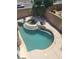 Private backyard oasis with a sparkling pool, integrated spa, and mature desert landscaping at 9622 Staff Ln, Las Vegas, NV 89178