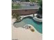 A refreshing backyard pool with a connected hot tub surrounded by desert landscaping at 9622 Staff Ln, Las Vegas, NV 89178