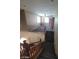 Carpeted staircase features wood railing that leads to a cozy upstairs loft space at 9622 Staff Ln, Las Vegas, NV 89178