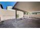 Desert landscaping and a brick patio under a shaded cover in this backyard at , Henderson, NV 89011