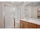 Bathroom featuring a glass shower with seat and a vanity with a mirror at , Henderson, NV 89011