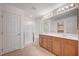 Bathroom with double sinks, vanity, and enclosed glass shower with a seat at , Henderson, NV 89011