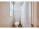 Bright bathroom featuring a toilet, shower-tub combo, and window with natural light at , Henderson, NV 89011