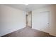 Cozy bedroom with neutral carpet and closet with sliding doors at , Henderson, NV 89011