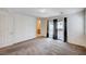 Bright bedroom with large windows, balcony access, and neutral carpet throughout at , Henderson, NV 89011