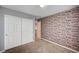 Bedroom with closet and faux brick accent wall at , Henderson, NV 89011