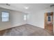 Bedroom with neutral carpet, two windows, and natural light at , Henderson, NV 89011
