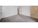 Spacious bedroom with neutral carpet, adjacent bathroom, and natural lighting at , Henderson, NV 89011