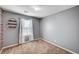 Bedroom featuring neutral carpet, with a decorative shelf and a window with coverings at , Henderson, NV 89011