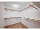 Walk-in closet featuring custom shelves and ample storage for clothing and accessories at , Henderson, NV 89011
