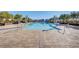 Large community pool surrounded by lounge chairs and umbrellas, offering a resort-style experience at , Henderson, NV 89011