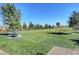 Spacious dog park with green grass and seating, fully fenced for safety and fun at , Henderson, NV 89011