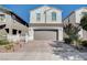 Inviting two-story home featuring a convenient two-car garage and a neatly paved driveway at , Henderson, NV 89011