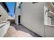 Side of home with brick driveway leading to the front door at , Henderson, NV 89011