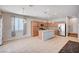 Spacious kitchen with granite island, tile floor, stainless steel appliances and modern lighting at , Henderson, NV 89011