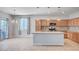 Modern kitchen features wooden cabinets, stainless steel appliances, a central island, and pendant lighting at , Henderson, NV 89011