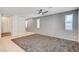 Open living room with tile flooring, ceiling fan, and decorative accent wall at , Henderson, NV 89011