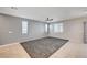 Large living room with tile flooring, ceiling fan, neutral paint, and window with blinds at , Henderson, NV 89011
