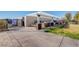 Outdoor kitchen area with grill, sink, and seating, perfect for community gatherings and barbecues at , Henderson, NV 89011