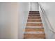 Carpeted stairs with white walls and silver handrail, leading to the upper level at , Henderson, NV 89011