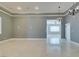 Elegant living area featuring modern lighting and neutral color palette at 10260 Hawks Wing St, Las Vegas, NV 89178