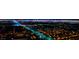 Striking aerial view of a vibrant city at night, showcasing illuminated buildings and bustling streets at 10733 Red Badge Ave, Las Vegas, NV 89166
