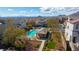 Stunning community pool and gazebo surrounded by lush landscaping and views of the city and mountains in the distance at 10733 Red Badge Ave, Las Vegas, NV 89166
