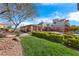 Manicured community pool area with lush landscaping, covered seating, and secure fencing at 10733 Red Badge Ave, Las Vegas, NV 89166