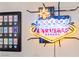Fun Welcome to Las Vegas neon sign and framed poker chip collection add to the home's decor at 10733 Red Badge Ave, Las Vegas, NV 89166