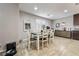 Cozy dining area with table, chairs, and a buffet with modern coffee bar setup at 10733 Red Badge Ave, Las Vegas, NV 89166