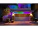 Charming two-story home with colorful holiday lighting and a spacious two-car garage at 10733 Red Badge Ave, Las Vegas, NV 89166