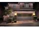 Charming two-story home with holiday lighting and a spacious two-car garage, with stone accents at 10733 Red Badge Ave, Las Vegas, NV 89166