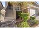 Charming two-story home with a stone accent exterior, a well-manicured yard, and an attached two-car garage at 10733 Red Badge Ave, Las Vegas, NV 89166