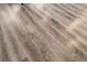 Close-up of the attractive and durable wood-look flooring throughout the home at 10733 Red Badge Ave, Las Vegas, NV 89166