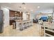 Spacious kitchen with an island and barstool seating, stainless appliances, and an open floor plan at 10733 Red Badge Ave, Las Vegas, NV 89166