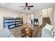 Inviting living room features hardwood floors, a ceiling fan and easy access to a carpeted staircase at 10733 Red Badge Ave, Las Vegas, NV 89166