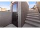 Stairway with glass door allows access to the rooftop patio area at 10733 Red Badge Ave, Las Vegas, NV 89166