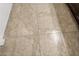 Close-up of the neutral-toned tile flooring, highlighting its pattern and texture at 10733 Red Badge Ave, Las Vegas, NV 89166