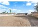 Expansive dirt backyard with perimeter fencing, ready for landscaping or future development at 1108 Putnam Ave, North Las Vegas, NV 89030