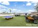 Spacious backyard with new turf, patio furniture, ping pong, and a grill for outdoor enjoyment at 1108 Putnam Ave, North Las Vegas, NV 89030