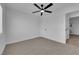 Cozy bedroom with carpeted floors and a ceiling fan at 1108 Putnam Ave, North Las Vegas, NV 89030