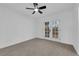 Cozy bedroom with carpeted floors, French doors, and plenty of natural light at 1108 Putnam Ave, North Las Vegas, NV 89030
