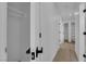 Hallway with wood-style vinyl floors and white walls leading to multiple rooms at 1108 Putnam Ave, North Las Vegas, NV 89030