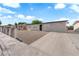 Single-story home with desert landscaping and a large driveway for convenient parking at 1108 Putnam Ave, North Las Vegas, NV 89030