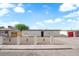 Exterior view of a single-story home, showcasing its fresh gravel landscaping and fence at 1108 Putnam Ave, North Las Vegas, NV 89030